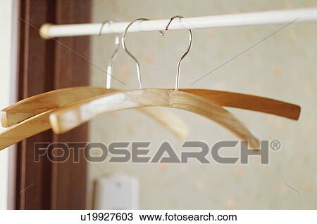 Stock Image - Hangers in closet. Fotosearch