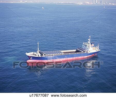 Stock Photo - Aerial view of a ship in the middle of the ocean. Fotosearch
