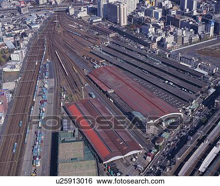 Aerial view of railway tracks and skyscrapers in the city View Large Photo Image Stock Photograph - Aerial view of railway tracks and skyscrapers in the city. Fotosearch