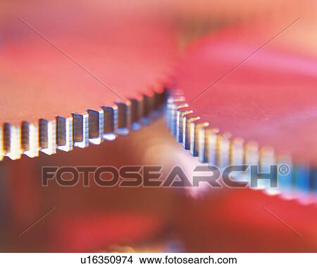 Picture - Close up of two metallic gears. Fotosearch