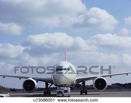 Front view of a huge plane on the runway View Large Photo Image Stock Image - Front view of a huge plane on the runway. Fotosearch