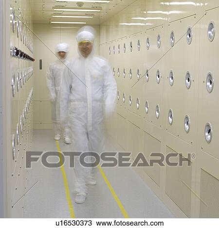 Front view of two people in white lab suits walking in corridor, blurred motion View Large Photo Image Stock Image - Front view of two people in white lab suits walking in corridor, blurred motion. Fotosearch