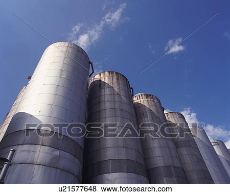 Low angle view of huge cylindrical containers View Large Photo Image Stock Photo - Low angle view of huge cylindrical containers. Fotosearch