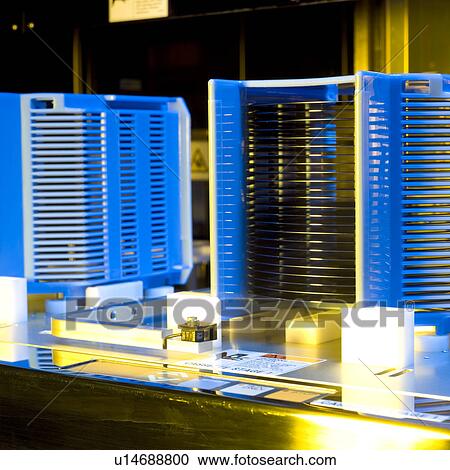 Stock Image - Side view of silicon wafer rack. Fotosearch