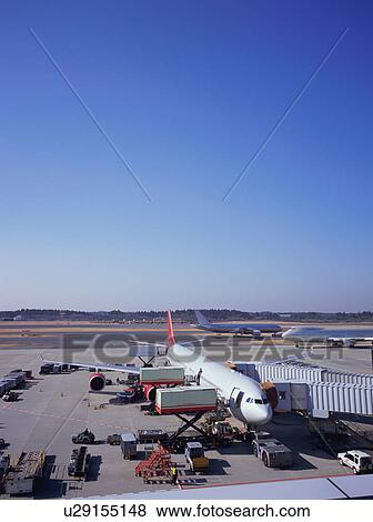 Three planes at the airport View Large Photo Image Stock Photo - Three planes at the airport. Fotosearch