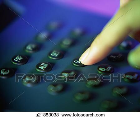 A person pressing numbers on the dial pad View Large Photo Image Stock Photo - A person pressing numbers on the dial pad . Fotosearch