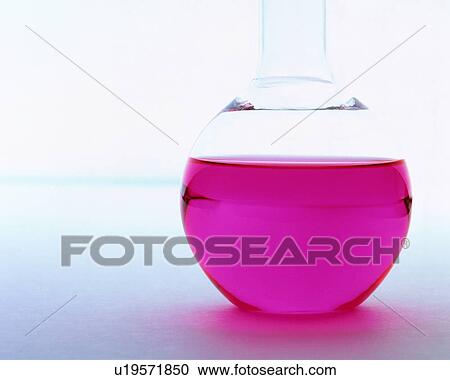 Stock Image - A pink colored solution in a round flask. Fotosearch