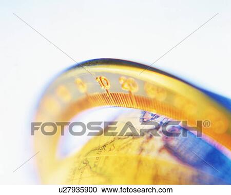 Stock Image - A round scale calibrated around the globe for measurements. Fotosearch