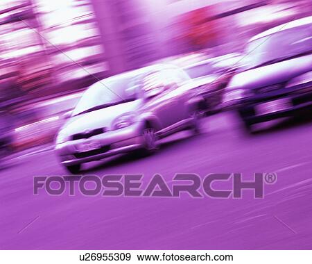Stock Photo - Cars zooming on a road, blurred motion. Fotosearch