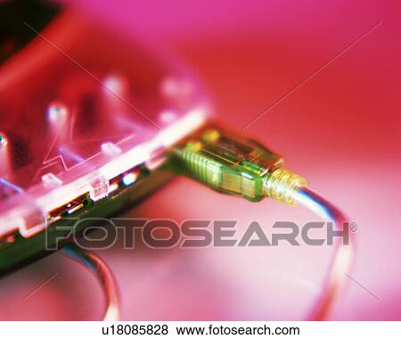 Stock Photo - Close up of plugs inserted in sockets of an electrical device. Fotosearch