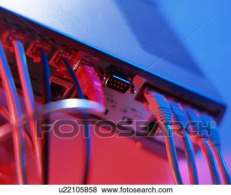 Stock Photo - Close up of plugs inserted in sockets of an electrical device. Fotosearch