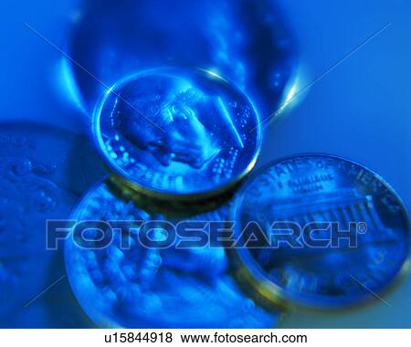 Stock Photo - Close up of the engraved coins. Fotosearch