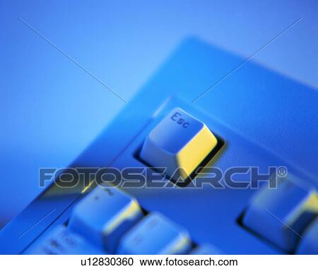 Stock Image - Close up of the escape key on the keyboard of a computer. Fotosearch