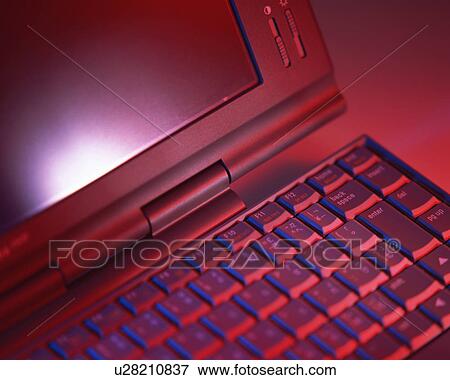 Stock Photo - Close up of the screen and the keyboard of a laptop. Fotosearch