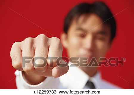 A man punching in front of a camera View Large Photo Image Stock Image - A man punching in front of a camera. Fotosearch