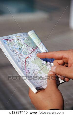 A person goes through city map View Large Photo Image Stock Image - A person goes through city map . Fotosearch