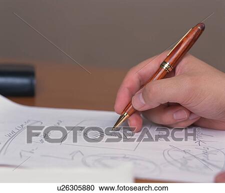 Close up of a human hand holding a pen View Large Photo Image Stock Image - Close up of a human hand holding a pen. Fotosearch