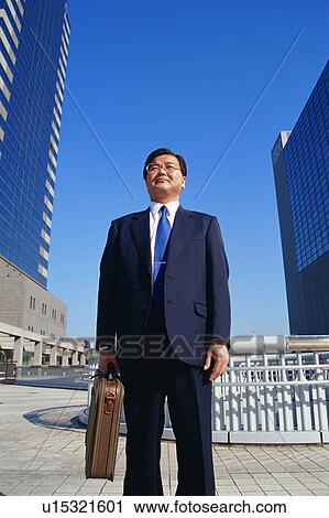 Stock Image - Front view of a mature man in suit. Fotosearch