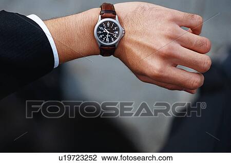 Stock Image - Front view of a wrist watch. Fotosearch