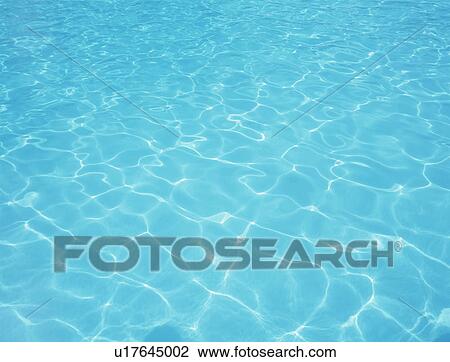 Stock Image - Placid water surface. Fotosearch
