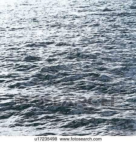 Placid water surface View Large Photo Image Stock Photo - Placid water surface. Fotosearch