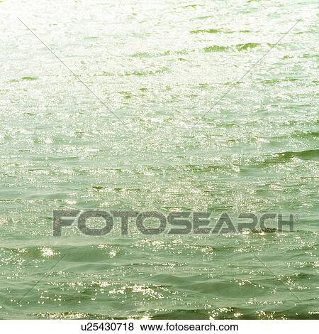 Stock Photo - Placid water surface. Fotosearch