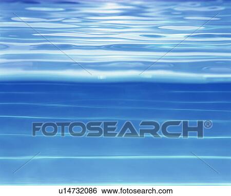 Stock Photograph - Placid water surface. Fotosearch