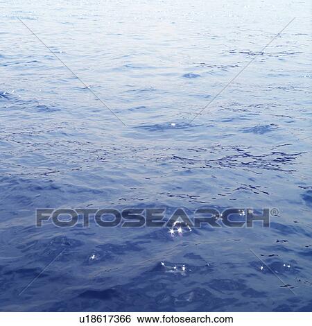 Stock Photograph - Placid water surface. Fotosearch
