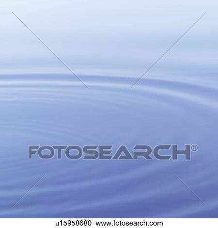 Stock Image - Ripples formed on a placid water surface. Fotosearch