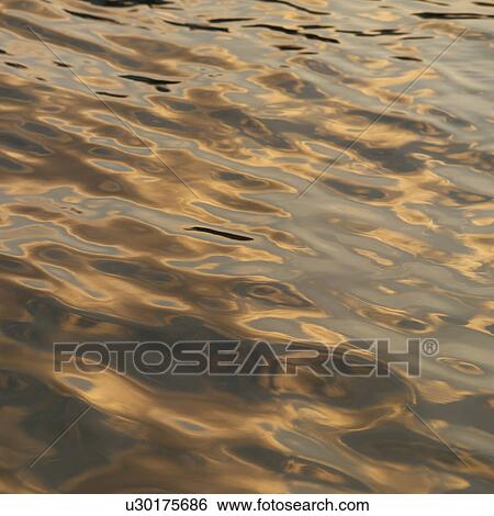 Stock Photograph - Ripples on water surface. Fotosearch