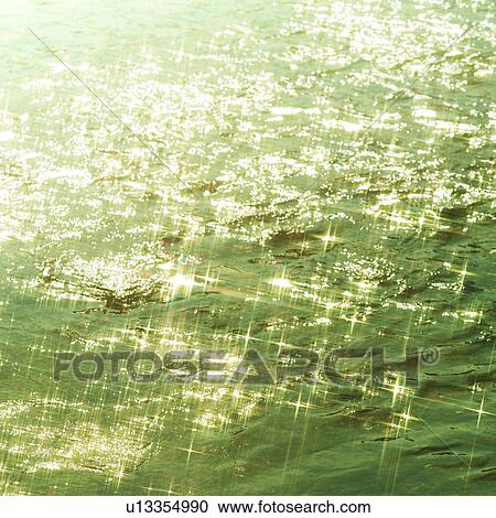 Sunlight reflected on water surface View Large Photo Image Stock Image - Sunlight reflected on water surface. Fotosearch