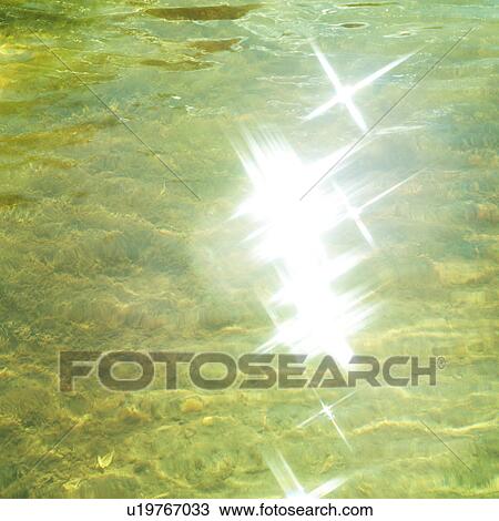 Sunlight reflected on water surface View Large Photo Image Stock Image - Sunlight reflected on water surface. Fotosearch