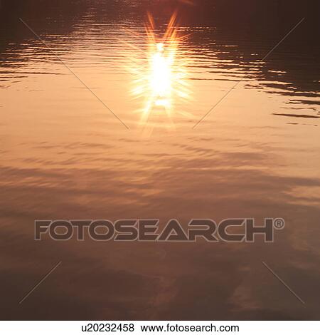 Sunlight reflected on water surface View Large Photo Image Stock Photo - Sunlight reflected on water surface. Fotosearch
