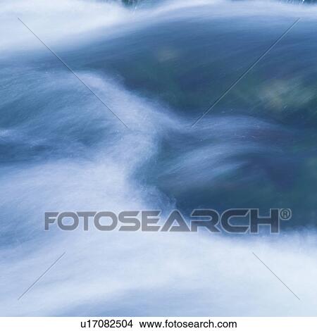 Water flowing rapidly in stream View Large Photo Image Picture - Water flowing rapidly in stream. Fotosearch