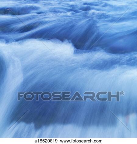 Water flowing rapidly in stream View Large Photo Image Stock Photo - Water flowing rapidly in stream. Fotosearch