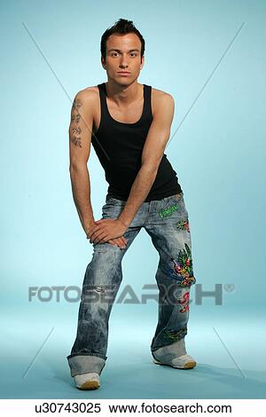 Stock Photography - Young man in casual clothing, studio shot. Fotosearch