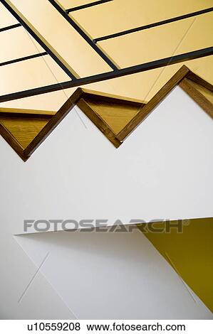 Stock Photo - Detail of Modern Hardwood Stairway and Yellow Wall. Fotosearch