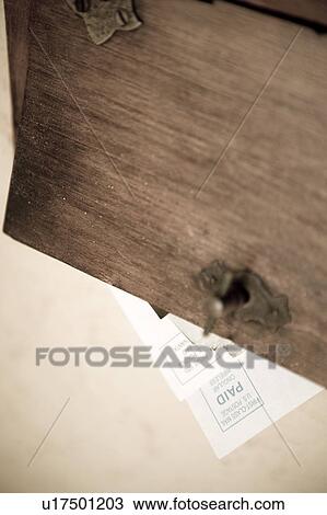 Stock Image - Mail under mail slot. Fotosearch