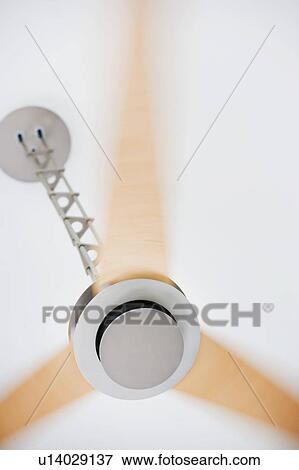 Stock Photo - Modern ceiling fan in motion. Fotosearch