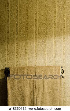 Stock Image - Towels on towel rack in bathroom. Fotosearch