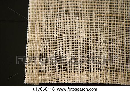 Stock Photo - Woven place mat on a black table. Fotosearch
