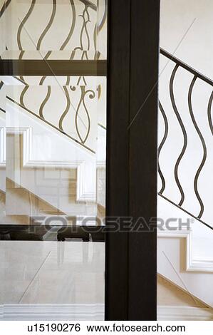 Wrought iron railing through door View Large Photo Image Stock Photograph - Wrought iron railing through door. Fotosearch