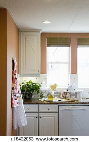 Aprons hanging on a kitchen wall View Large Photo Image Stock Image - Aprons hanging on a kitchen wall. Fotosearch