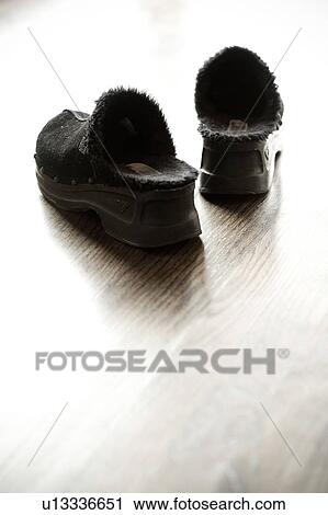 black slippers on hardwood floor View Large Photo Image Stock Image - black slippers on hardwood floor. Fotosearch