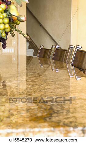 Stock Image - Countertop with chairs. Fotosearch
