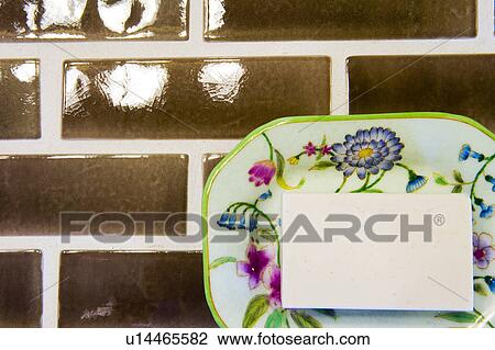 Stock Image - Detail of colorful soap dish with soap.. Fotosearch