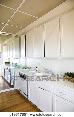Stock Image - Kitchen with White Cabinets. Fotosearch