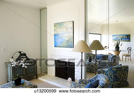 Living room with fireplace and blue accents View Large Photo Image Stock Photo - Living room with fireplace and blue accents. Fotosearch