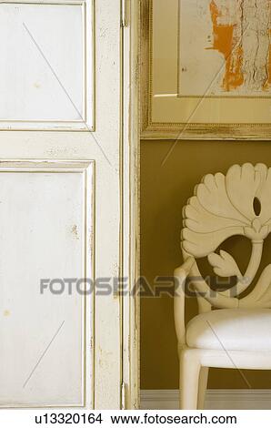 Picture - Ornate white chair and armoire. Fotosearch