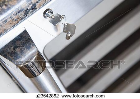 Wine refrigerator lock View Large Photo Image Stock Image - Wine refrigerator lock. Fotosearch